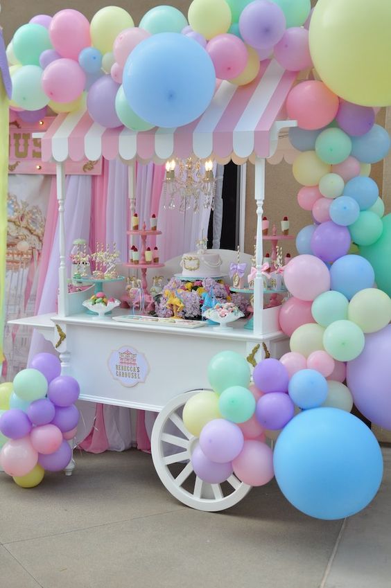 candy cart in carnaval theme with colored balloons